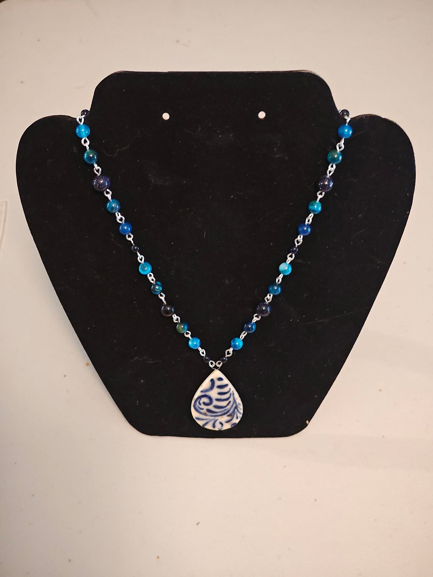 Blue Beaded Necklace with Blue Scrollwork Pendant - C108