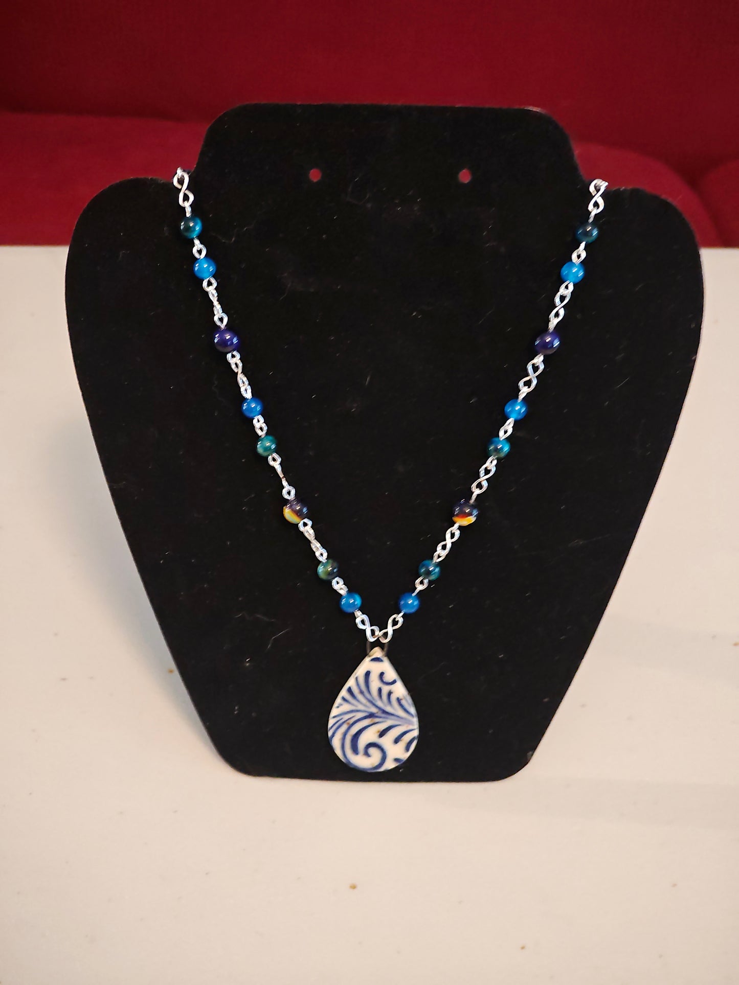 Blue Beaded Necklace with Scrollwork Pendant - C118